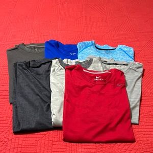 Lot of 7 mens Large dri-fit/moisture wicking athletic shirts.